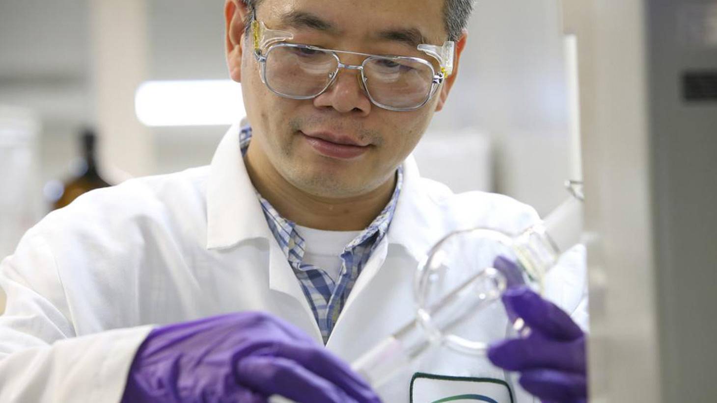 Clinical Researcher handling test equipment