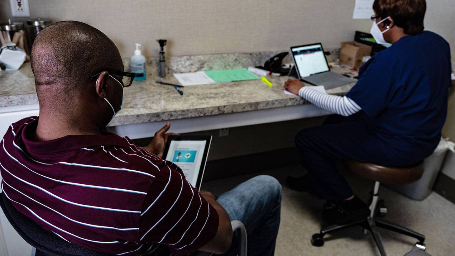 Patient reading information on tablet
